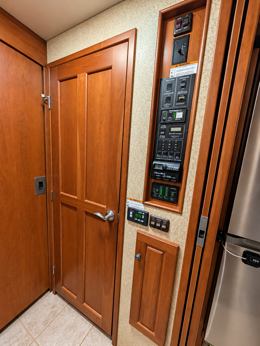 Vectra hallway with wood passage door beside the recessed central systems control panel
