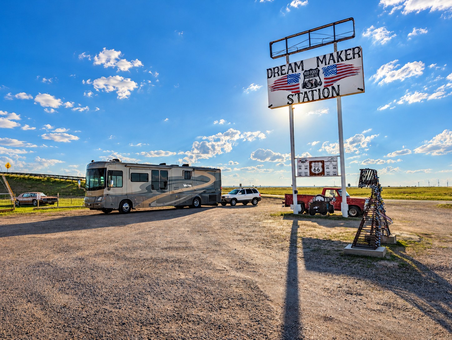 The Vectra and Santa Fe beside the Dream Maker Station mid-point Route 66 sign in Adrian, Texas