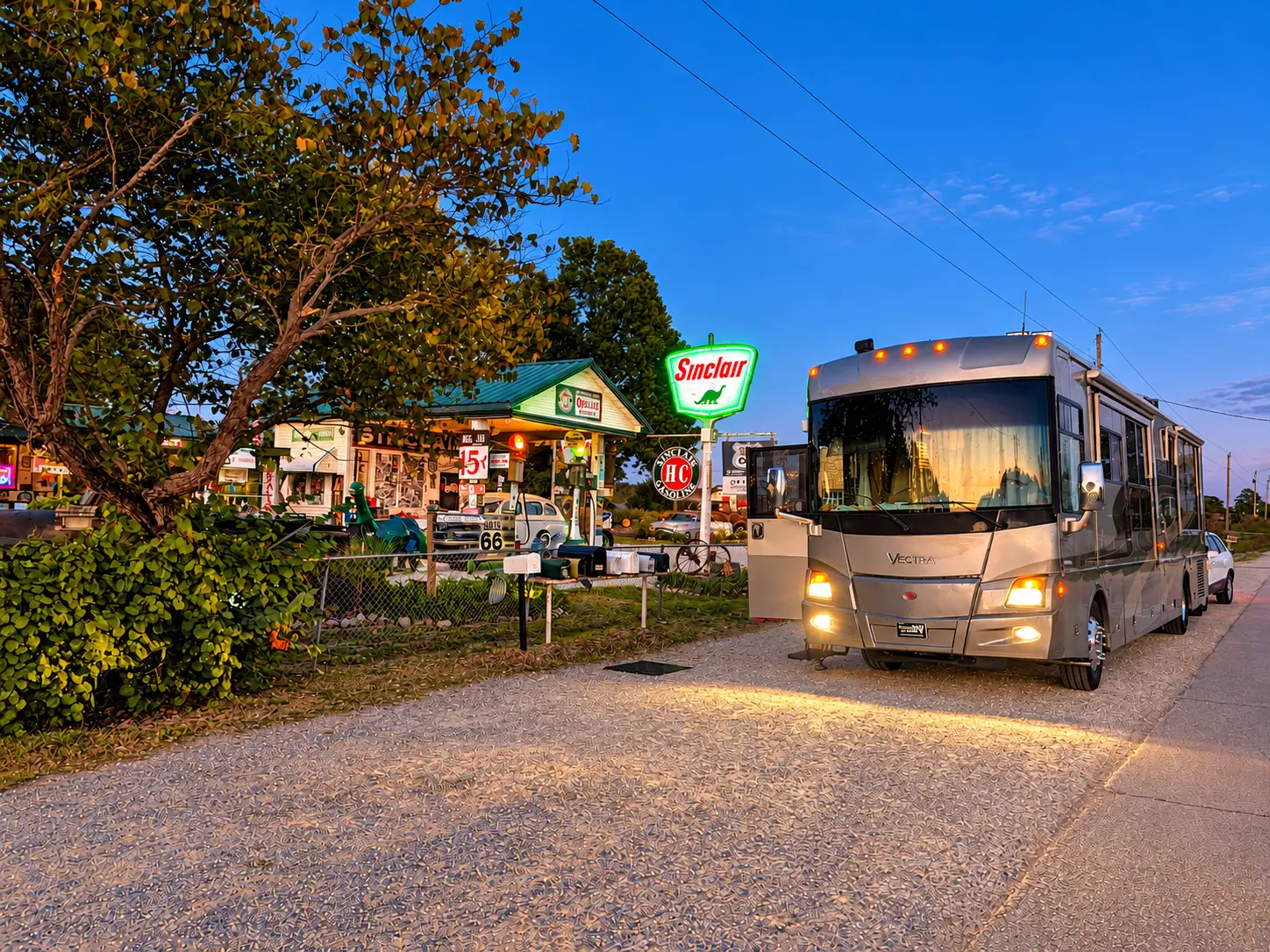 The Vectra parked at a Sinclair station on Route 66 at twilight