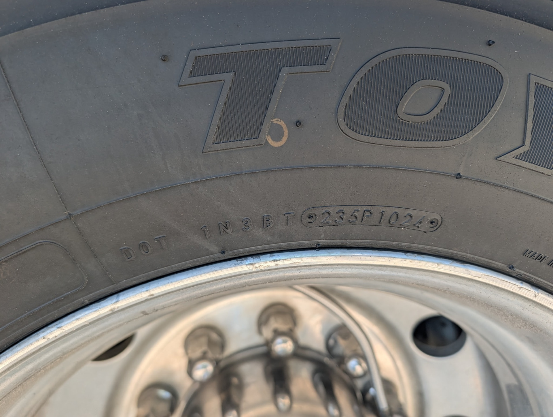 Close-up of a tire sidewall DOT date code 1024